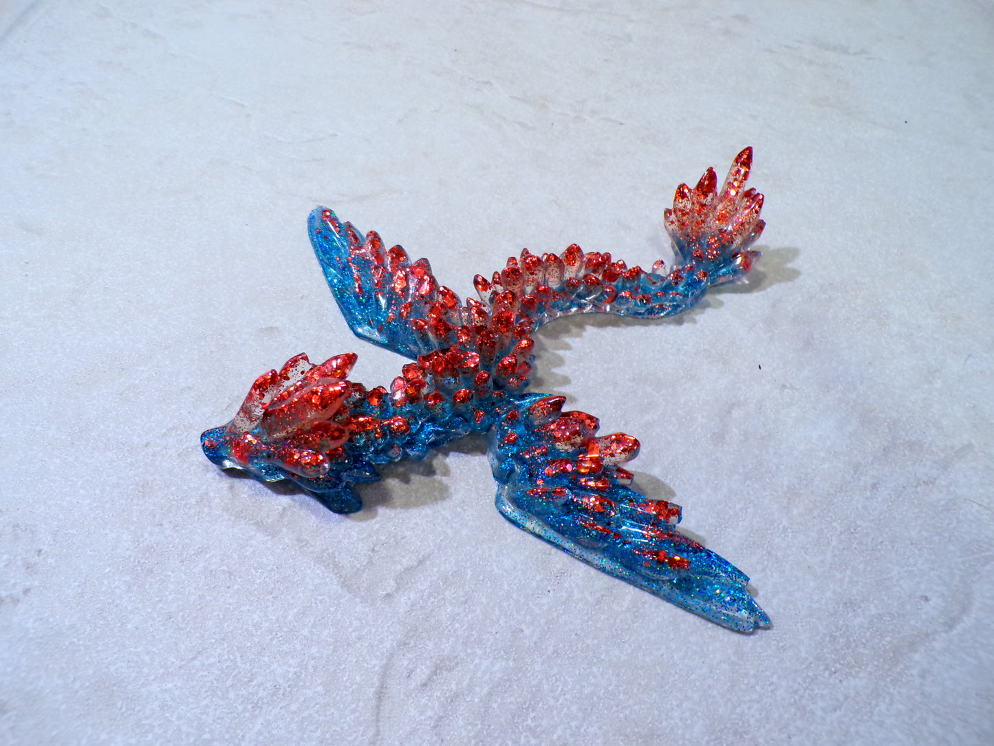 FLYING DRAGON W/ EYELETS TO HANG BLUE & RED GLITTER