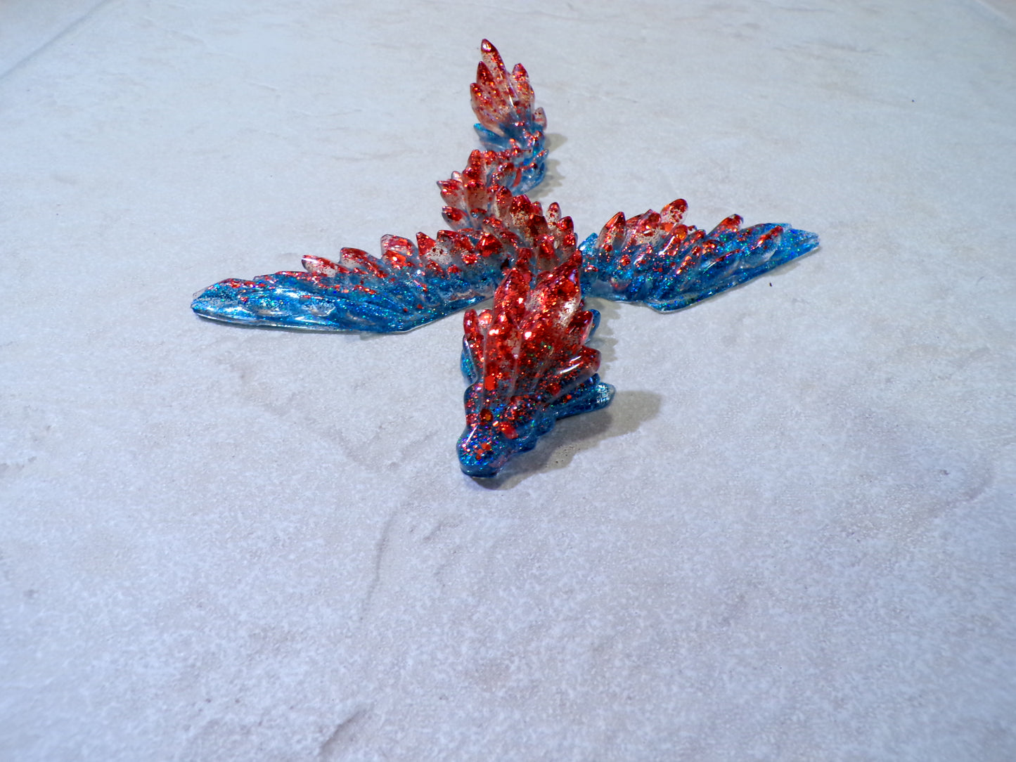 FLYING DRAGON W/ EYELETS TO HANG BLUE & RED GLITTER